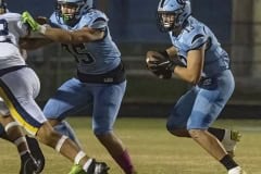 Nature coast , 13, Brady Nowlan tries to read the block by , 35, Talyn Poole. Photo by JOE DiCRISTOFALO