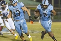 Nature Coast ,2, Christian Comer gets led around the end by ,13, Brady Nowlan for a long gain. Photo by JOE DiCRISTOFALO