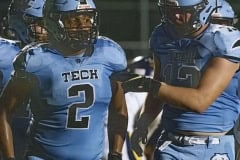 Nature Coast ,2, Christian Comer gets congratulated  by ,13, Brady Nowlan after a touchdown run. Photo by JOE DiCRISTOFALO