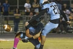 Nature Coast ,20, Caiden Mellecker punctuates a touchdown with the extra point out of the hold by ,23, Allan Ho. Photo by JOE DiCRISTOFALO