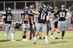 Friday night Varsity game Branford vs Central October 14, 2022 at Central. QB, WR, OLB Jr. No 14 Braden Joyner warms up before the game.