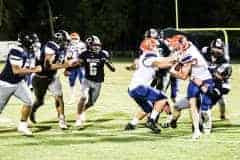 Bears No 11 Tyler Thorne (Fr) tackles Buccaneers No 8 Trevor Maddox Friday night's game, 10/14/22. Photo by Cheryl Clanton.