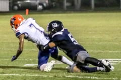 Central Bear No. 50 Carlos O'Neil takes down Buccaneer No. 7 Arkayvion Jones in Friday night's Homecoming game against Branford. Photo by Cheryl Clanton.