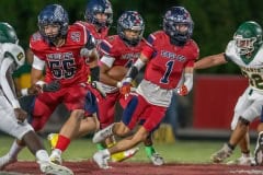 Springstead Eagle running back, 4, Connor Mccazzio follows blocking by, 55, Armando Hernandez and,1, Luca Garguillo during the 14-0 win against the Lecanto. Photo by JOE  DiCRISTOFALO