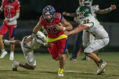 Springstead QB ,15, Ayden Ferguson breaks through the Lecanto defense on a keeper play during a scoring drive Friday at Booster Stadium. Photo by JOE DiCRISTOFALO