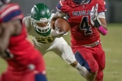 Eagle running back, 4, Connor Mccazzio rushes for a first down against the Lecanto defense. Photo by JOE  DiCRISTOFALO