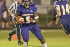 Hernando High running back John Capel III runs for a gain after taking a hand off from ,14, Michael Saltsman during the Homecoming game against Crystal River. Photo by JOE DiCRISTOFALO