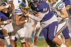 Hernando High, 54, Jesse Harmon stops a Crystal River running back for a loss Friday in Brooksville. Photo by JOE DiCRISTOFALO