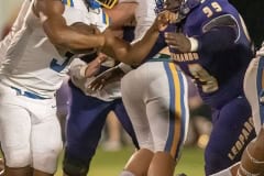 Hernando High, 99, Devin Williams locks down a Crystal River running back for a loss Friday in Brooksville. Photo by JOE DiCRISTOFALO