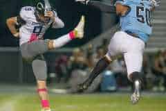 Nature Coast, 50, Gabriel Rios came close to blocking the punt of Central, 9, Colt Botner but was flagged for running into the kicker on the play. Photo by JOE DiCRISTOFALO