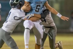 NCT QB, 5, Jackson Hoyt  gets wrapped up by  Central High ,11, Malachi Russell and ,24, Andres Gordon Nunez Friday at Nature Coast.  Photo by JOE DiCRISTOFALO