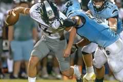 NCT, 50, Gabriel Rios sacks Central High QB,14, Bradyn Joyner but was called for a facemark penalty on the play  Friday at Nature Coast.  Photo by JOE DiCRISTOFALO