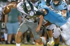 NCT, 50, Gabriel Rios sacks Central High QB,14, Bradyn Joyner but was called for a facemark penalty on the play  Friday at Nature Coast.  Photo by JOE DiCRISTOFALO