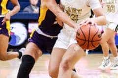 Tuesday night 11/8/22 at the Eagles' Nest, the Fourth Annual Preseason Classic Girls Basketball Tournament. Hernando vs Plant High School. Leopard #5 Sr. Lydia Jackson goes on the defense against Plant to strip the ball.  Photo by Cheryl Clanton.