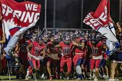 Springstead breaks the banner before the Homecoming game defending their perfect season record taking on Land O’ Lakes.  Players include 9, Taylor Fussell, 88, Caidell Gilbert, and, 80, Michael Rizzutto. Photo by JOE DiCRISTOFALO