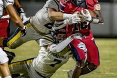 Springstead ,12, Tyree Davis runs for a gain finally taken down by Land O’ Lakes ,8, Donte Turner and ,7, Devin Gilbertson. Photo by JOE DiCRISTOFALO