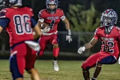 Springstead ,4, Connor Mccazzio sizes up the blocking on a running play. Photo by JOE DiCRISTOFALO