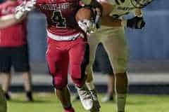 Springstead ,4, Connor Mccazzio blasts through a tackle to score his second touchdown in the game versus Land O’ Lakes. Photo by JOE DiCRISTOFALO