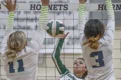 Hornets ,5, Joelysee Morales managed to split the Central defense of ,11, Natalie Kupres and ,3, Jaylene Sanchez on this play. Photo by JOE DiCRISTOFALO