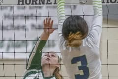 Weeki Wachee ,16, Shauna Murphy squeezes a hit past Central High’s ,3, Jaylene Sanchez. Photo by JOE DiCRISTOFALO