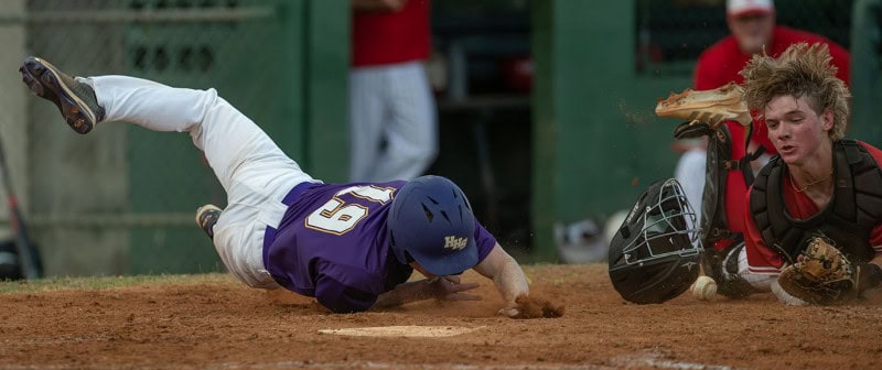 Hernando High TJ Rodier took the hard way to home through a tag attempt by the Satellite catcher in Tuesday Night action in Brooksville. Rodier scored as the ball came loose from the catchers glove on the play.  Photo by JOE DiCRISTOFALO