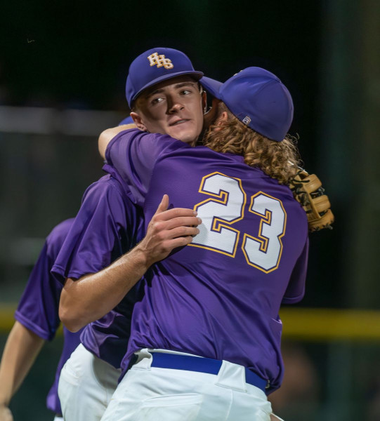 Hernando pitcher, Michael Savarese gets congratulated by team mate, 23, Tyson Morgan after the 6-0 win over Satellite High. Hernando travels to North Marion Friday night to take on the top seeded Colts in a Regional semi-final game.  Photo by JOE DiCRISTOFALO