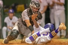 Hernando High’s Henry Robinson slides safely into third base Tuesday night in the home game versus Weeki Wachee. Photo by JOE DiCRISTOFALO