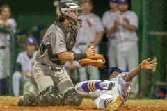 Hernando High’s Henry Robinson slides safely into third base Tuesday night in the home game versus Weeki Wachee. Photo by JOE DiCRISTOFALO