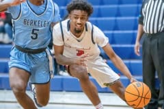 Springstead High, 3, Divine Torain, tries to drive past the defense by Berkeley Prep ,5, Damien Henderson  Wednesday 12/21/2022 in the 8th Annual Greg O’Connell Shootout at Springstead High.  Photo by JOE DiCRISTOFALO