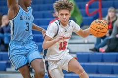 Springstead High,12, Austin Nicholson looks for a path to the basket while guarded by Berkeley Prep ,3, George Kimble  Wednesday 12/21/22 in the 8th Annual Greg O’Connell Shootout at Springstead High.  Photo by JOE DiCRISTOFALO