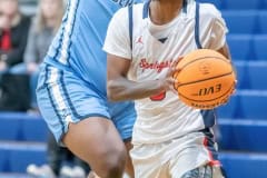 Springstead High, 3, Divine Torain,eyes the basket while guarded by by Berkeley Prep ,11, Nikhil Jefferson  Wednesday 12/21/2022 in the 8th Annual Greg O’Connell Shootout at Springstead High.  Photo by JOE DiCRISTOFALO