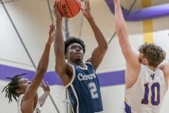 Central High, 2, J D Watson tries a jump shot between the defense by Hernando High, 0, Liandre Wright and Michael Savarese, 10, Tuesday 1/17/23 at Hernando High. Photo by JOE DiCRISTOFALO