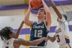 Central High, 12, Caden Bergantino,shoots against the defense by Hernando ,0, Liandre Wright and Josiah Wright ,3, Tuesday 1/17/23 in Brooksville. Photo by JOE DiCRISTOFALO