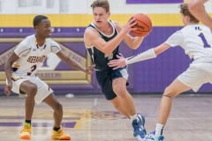 Central High, 4, Braden Joyner tries to spli tHernando defenders Josiah Wright ,3, and Drew Bittinger ,1, on his way to the basket Tuesday 1/17/23 in Brooksville. Photo by JOE DiCRISTOFALO