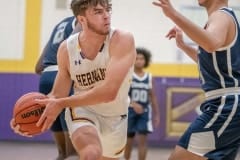 Hernando High, 10, Michael Savarese looks for an outlet pass on the baseline while defended by Central High Basel Nassir Tuesday 1/17/23 at Hernando High. Photo by JOE DiCRIDSTOFALO