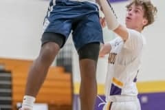 Central High, 00, Tylor Daniel skies on his way to the basket while defended by Hernando High’s Drew Bittinger Tuesday 1/17/23 in Brooksville. Photo by JOE DiCRISTOFALO