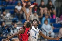 Springstead, 4, Caidell Gilbert vies for the jump ball with Central ,2, JD Watson Friday night at Central High School. Photo by JOE DiCRISTOFALO