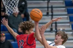 Central High, 12, Caden Bergantino tries to put up a shot against the defense by Springstead, 12, Austin Nicholson Friday night at Central High. Photo by JOE DiCRISTOFALO