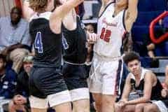 Central's #4 Junior Braden Joyner and #14 FR. Ethan Bergantino blocking Eagles #12 Junior Austin Nicholson in Thursday night's game, 12/1.Photo by Cheryl Clanton.