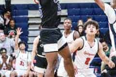 Centrals #25 Junior Tykel Williams jumps to avoid the swarm of Eagles to make the shot.Photo by Cheryl Clanton.