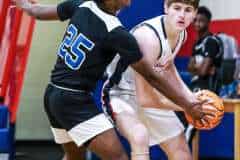 Eagels #20 Junior Andrew Danchise fights against Central #25 Junior Tykel Williams to keep control of the ball.Photo by Cheryl Clanton.