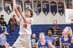 Eagles' #12 Jr. Austin Nicholson takes the ball down court and goes in for the point against Crystal River Tuesday night. Photos by Cheryl Clanton.