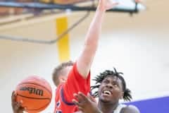 Hernando High ,23, Jesse Stewart goes under the defense by Springstead ,45, Mikey Lanziero to complete a layup Tuesday 1/3/23 at Hernando High. Photo by JOE DiCRISTOFALO