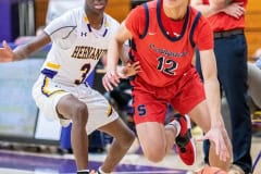 Keith Smith works around Hernando ,3, Josiah Wright Tuesday 1/3/23 at Hernando High. Photo by JOE DiCRISTOFALO