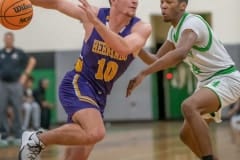 Hernando High, 1o, Michael Savarese goes hard around the defense by Weeki Wachee, ,24, Anthony Wilson Tuesday 1/24/23 in Brooksville. Photo by JOE DiCRISTOFALO