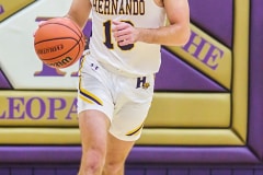 Tuesday night December 13, 2022 HHS took on WW in boys Basketball. Leopard Sr. #10 Michael Savarese brings it down the court against the Hornets. Photo by Cheryl Clanton.