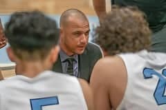 Nature Coast Tech Head Coach, David Piscarcik, confers with his team during a time-out Tuesday in the game against visiting Hernando High. Photo by JOE DiCRISTOFALO