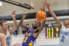 Hernando High, 23, Jesse Stewart has a shot attempt blocked by Nature Coast, 2, Sheldon Cotton Tuesday at NCT. Photo by JOE DiCRISTOFALO