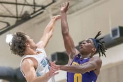 Hernando High, 0, Liandre Wright shoots over the defense by NCT ,14, Canyon Anderson during the match Tuesday at Nature Coast Tech.  Photo by JOE DiCRISTOFALO