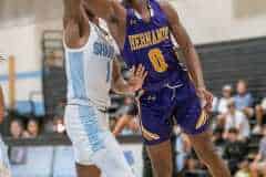 Hernando High, 0, Liandre Wright attempts an underhand lay up while guarded by NCT, 1, Dwight Clemons during the game Tuesday at Nature Coast.  Photo by JOE DiCRISTOFALO